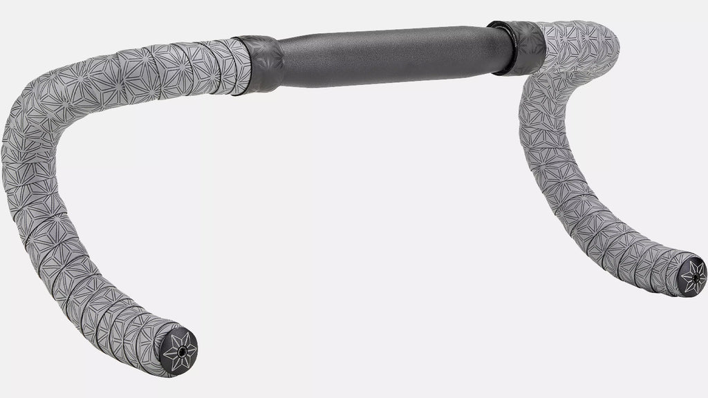 Gray bicycle drop handlebar grips with a geometric star pattern and a dark gray padded handlebar section, shown on a light gray background.