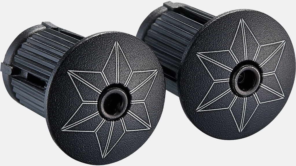 Two black plastic components with star-shaped cutouts on a white background