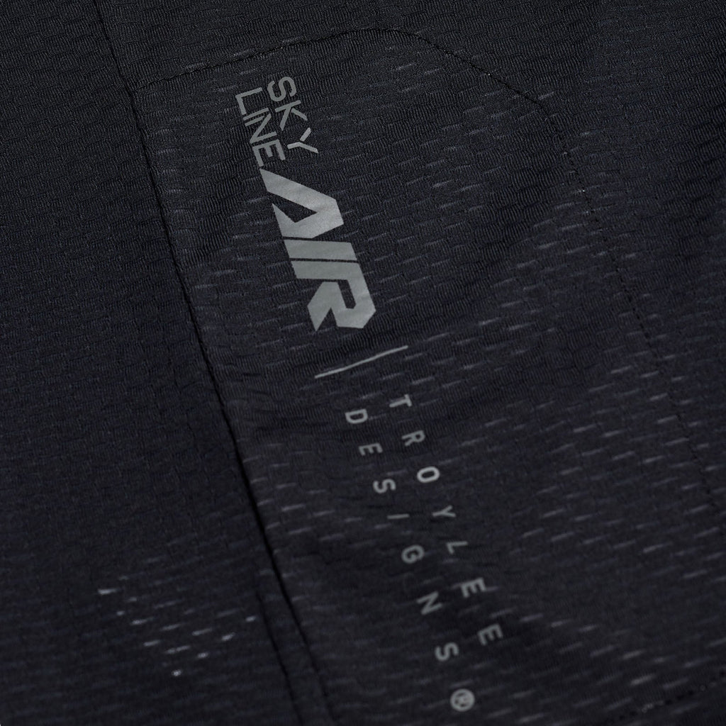 Close-up of a black jacket with 'Sky Line Air' and 'Troy Lee Designs' branding.