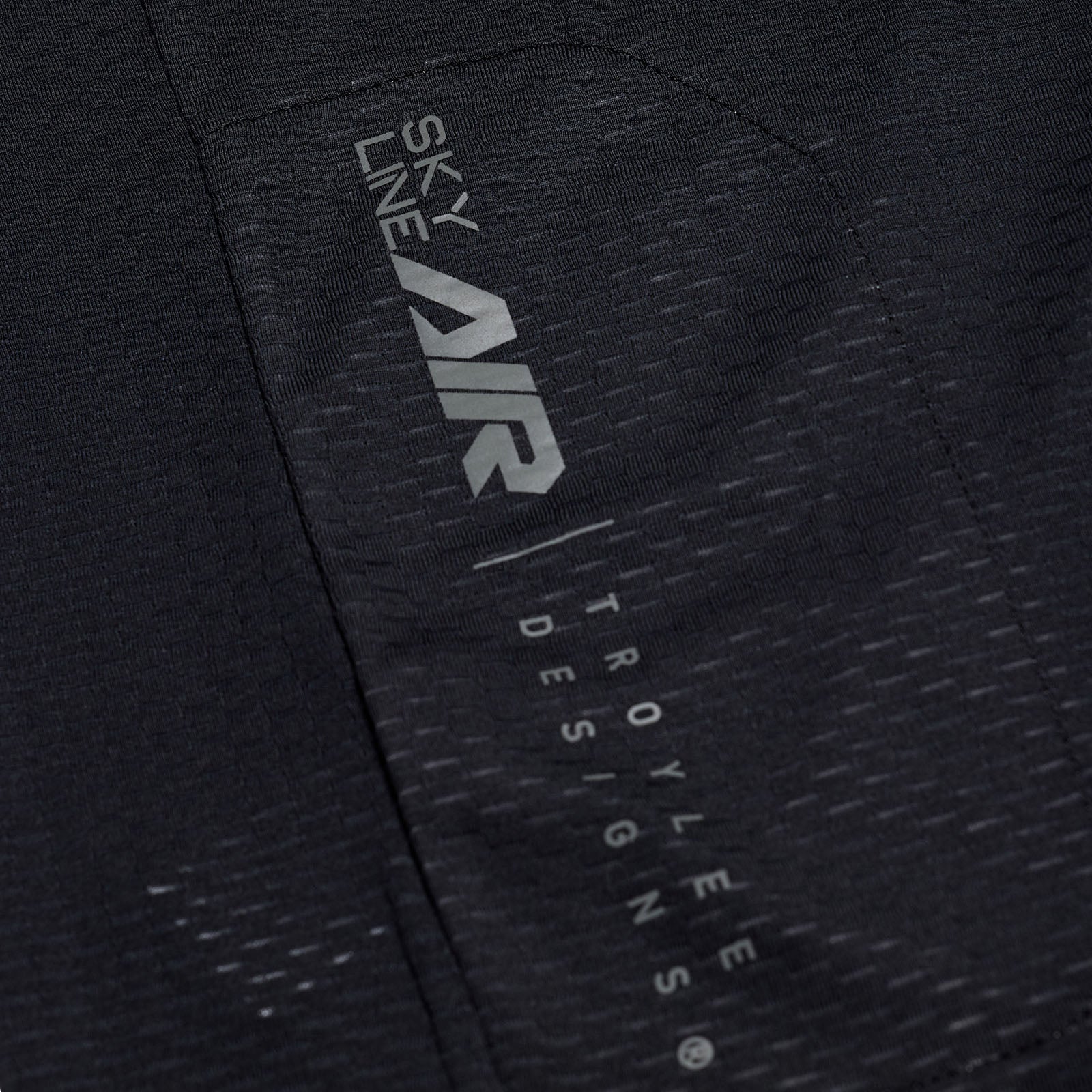 Close-up of a black jacket with 'Sky Line Air' and 'Troy Lee Designs' branding.