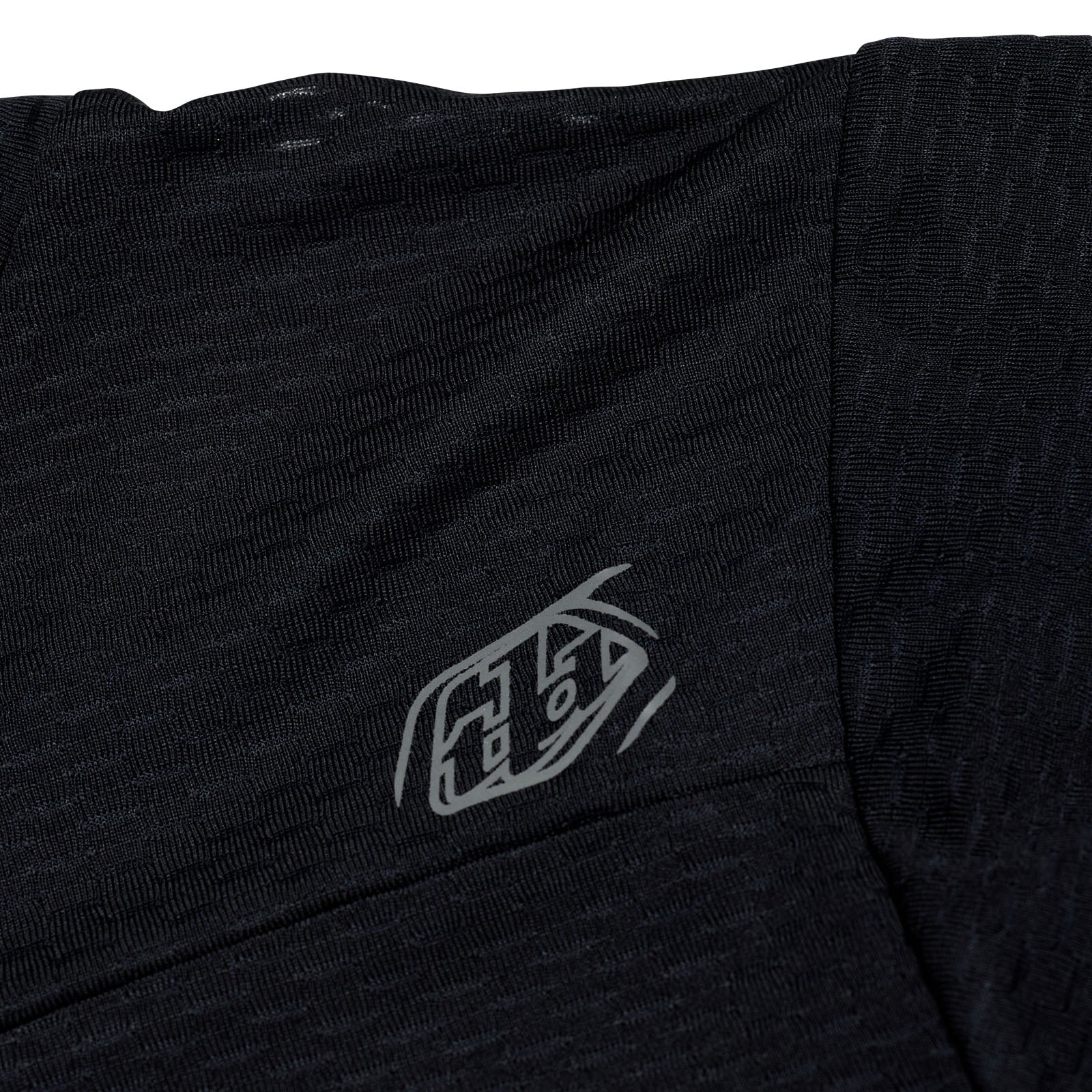 Black t-shirt with a logo on the chest against a white background