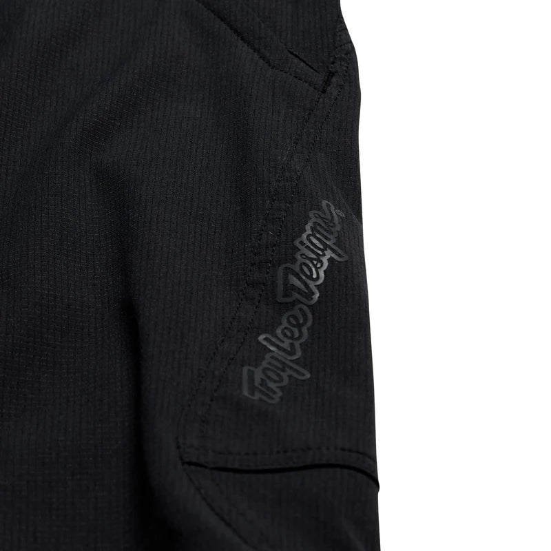 Black jacket with 'Troy Lee Designs' logo on sleeve against a white background