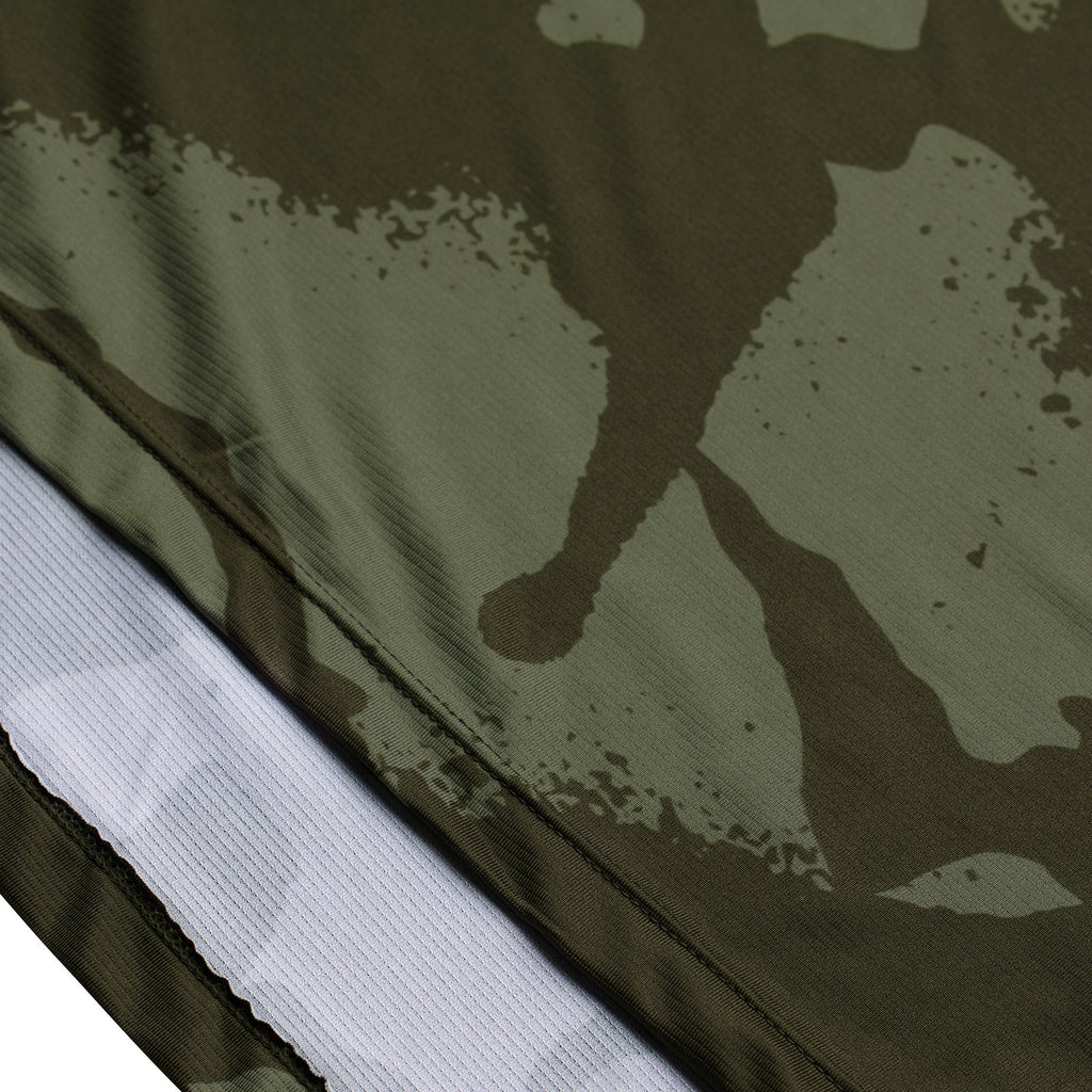 Close-up of a camouflage pattern on fabric with a white border.