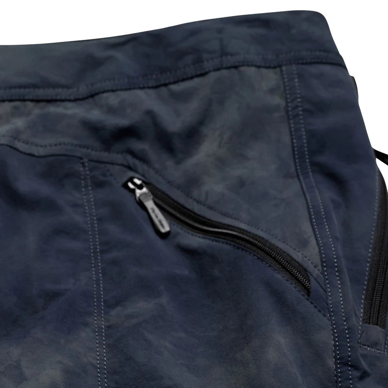 Close-up of a navy blue jacket with a zipper on a white background