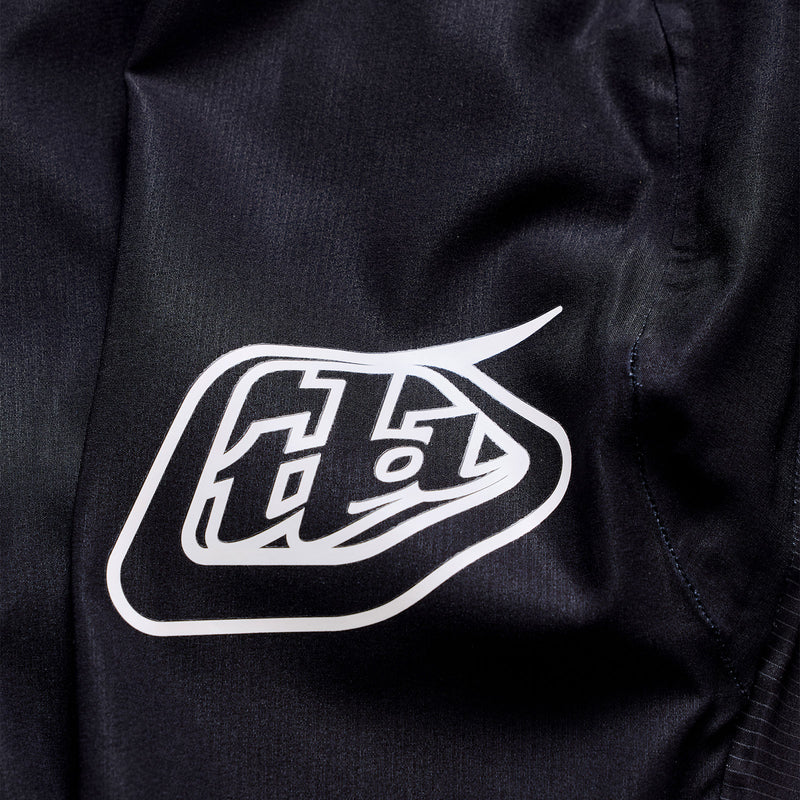 Black jacket with a white logo on the chest