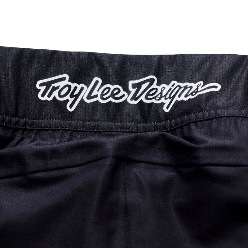 Black jacket with 'Troy Lee Designs' logo on a white background