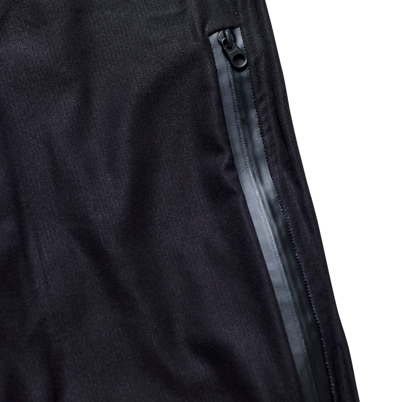 Close-up of a black jacket with a zipper on a white background