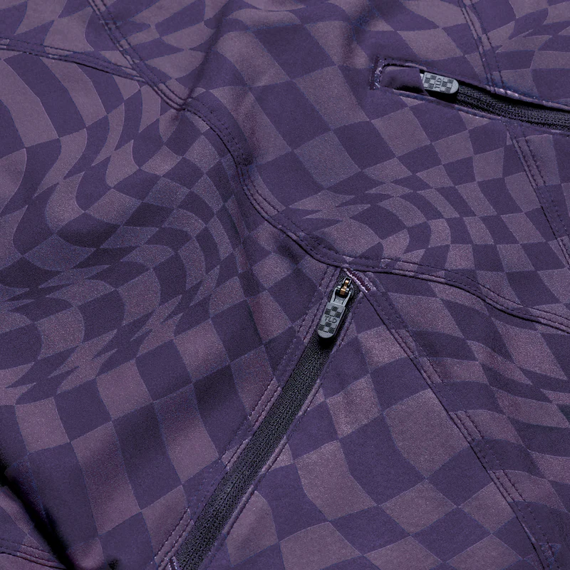Close-up of a purple checkered jacket with zippers.