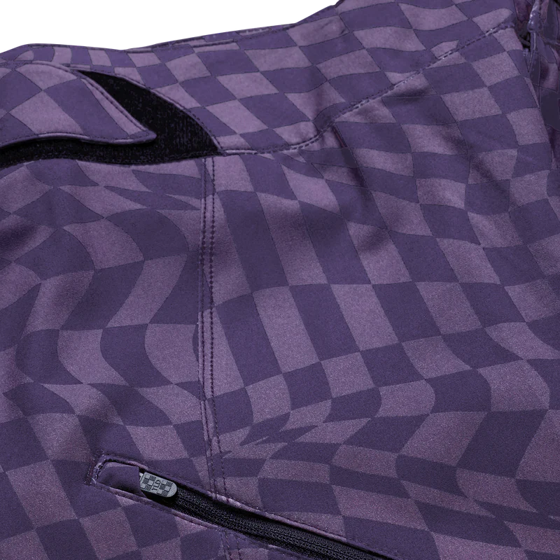 Close-up of a purple checkered jacket with a zipper detail on a white background