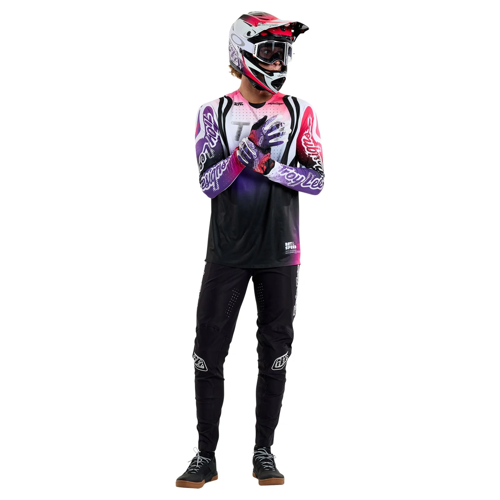 Person wearing a mountain biking outfit with helmet and gloves on a white background