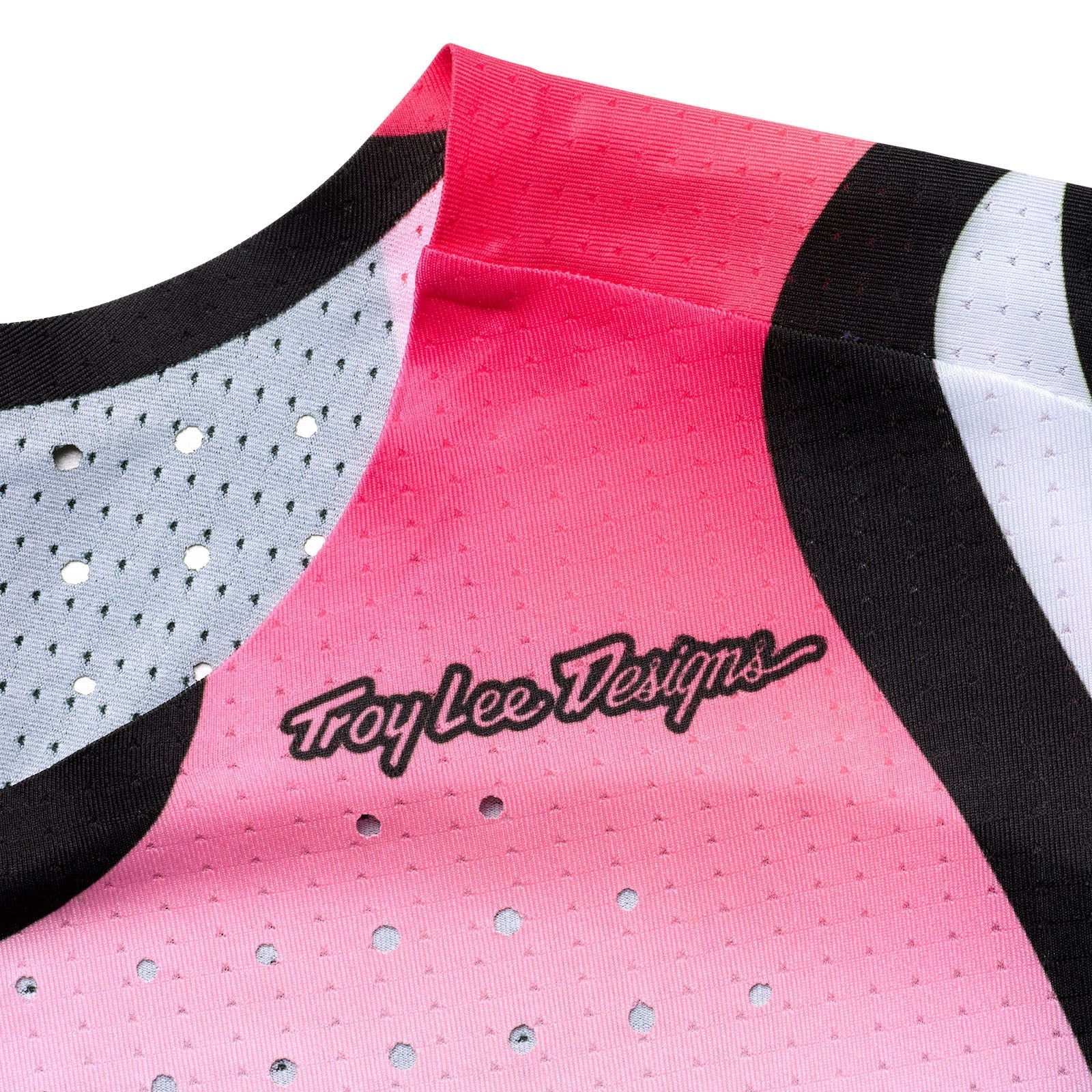 Pink sports jersey with black and white accents and 'Troy Lee Designs' logo.