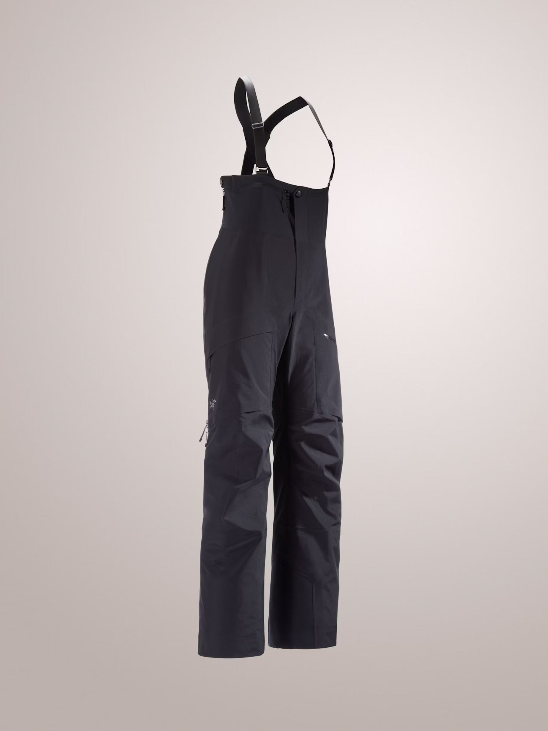 Black bib overalls on a light gray background