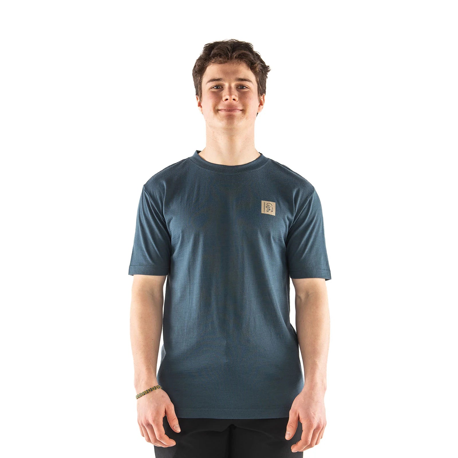 Man wearing a blue t-shirt with a logo on a white background