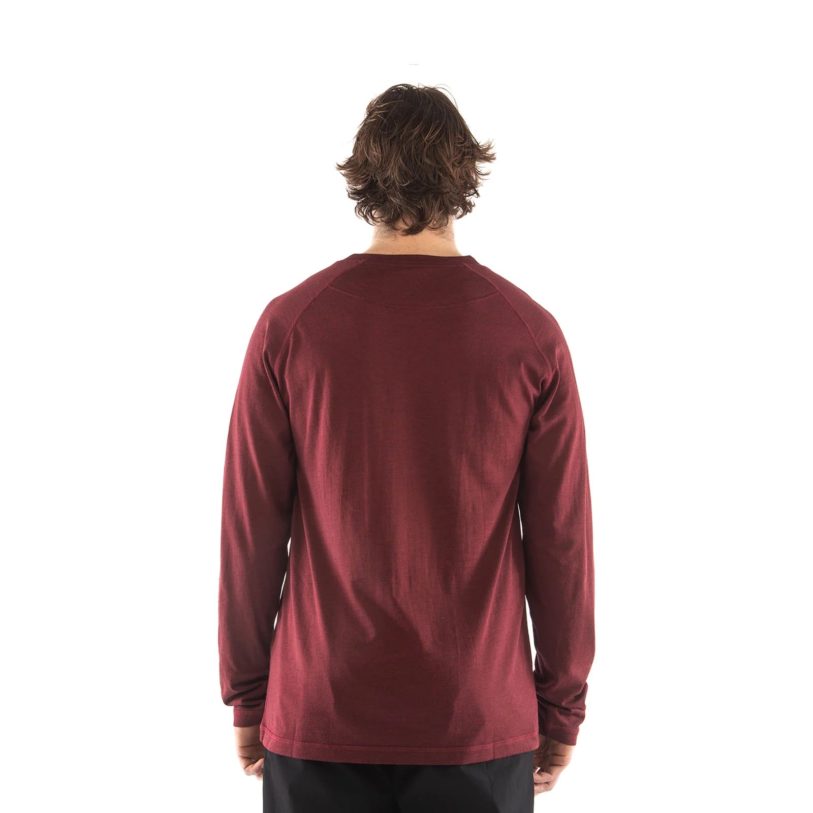 Person wearing a maroon long-sleeve shirt on a white background