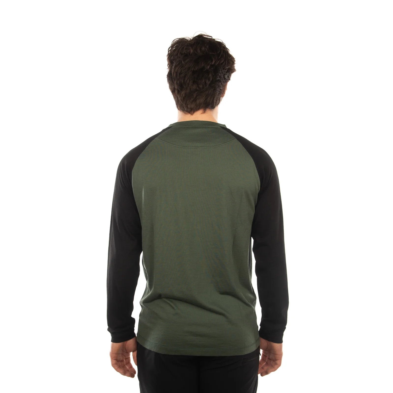 A man viewed from behind wearing a long-sleeve raglan shirt with an olive green body and black sleeves, set against a plain white background.