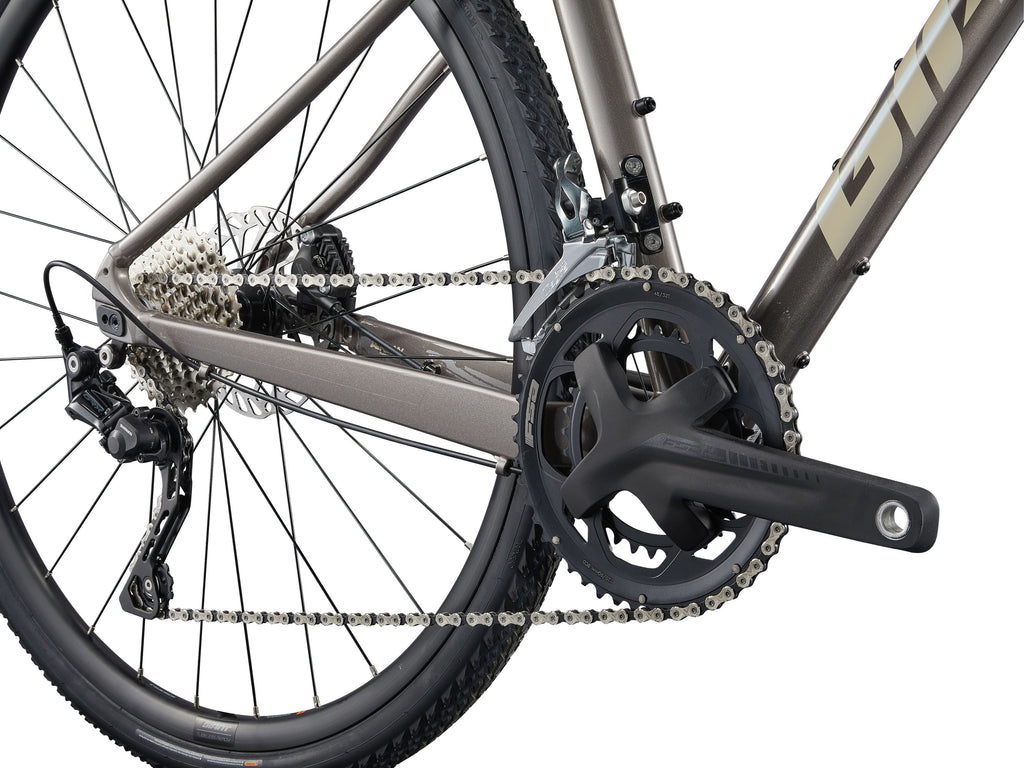 Close-up of a bicycle chain and gear system on a white background