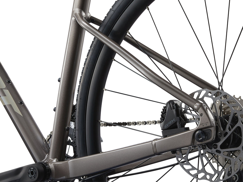 Close-up of a bicycle's rear wheel and gear system on a white background