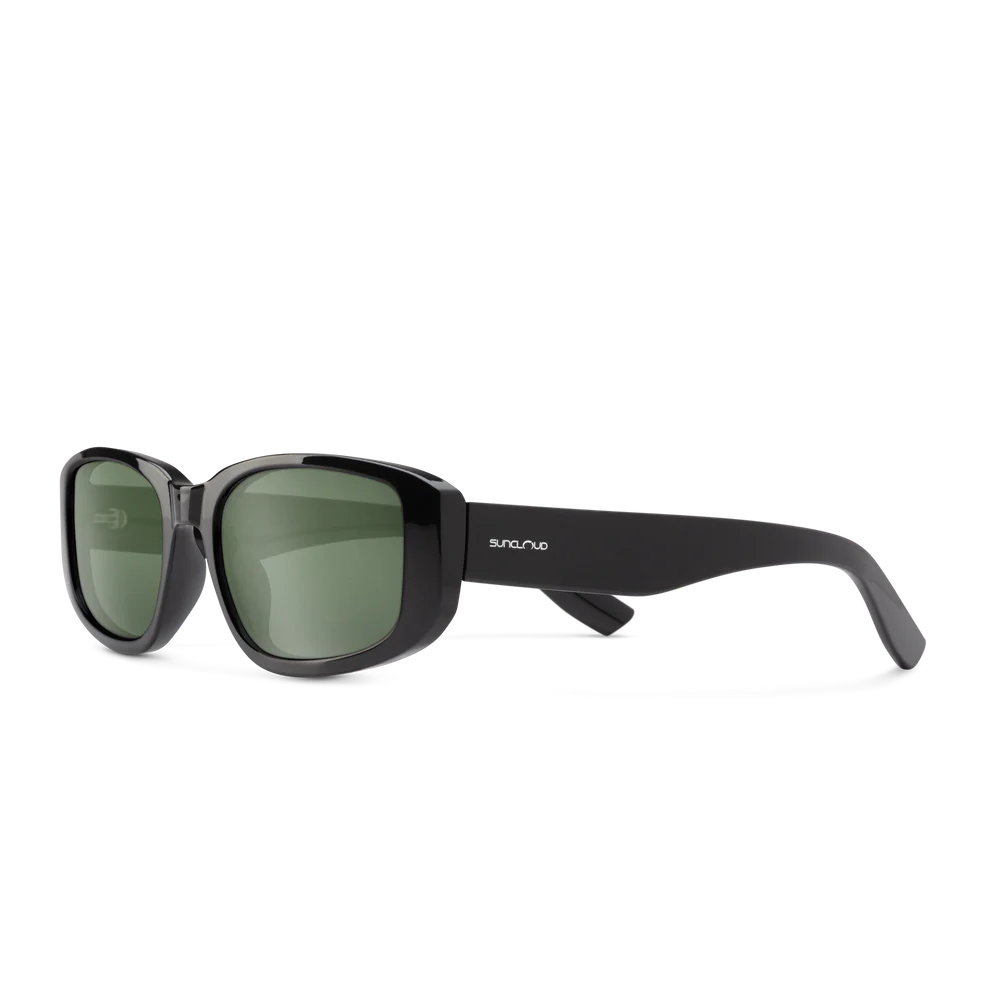 Black sunglasses with green lenses on a white background