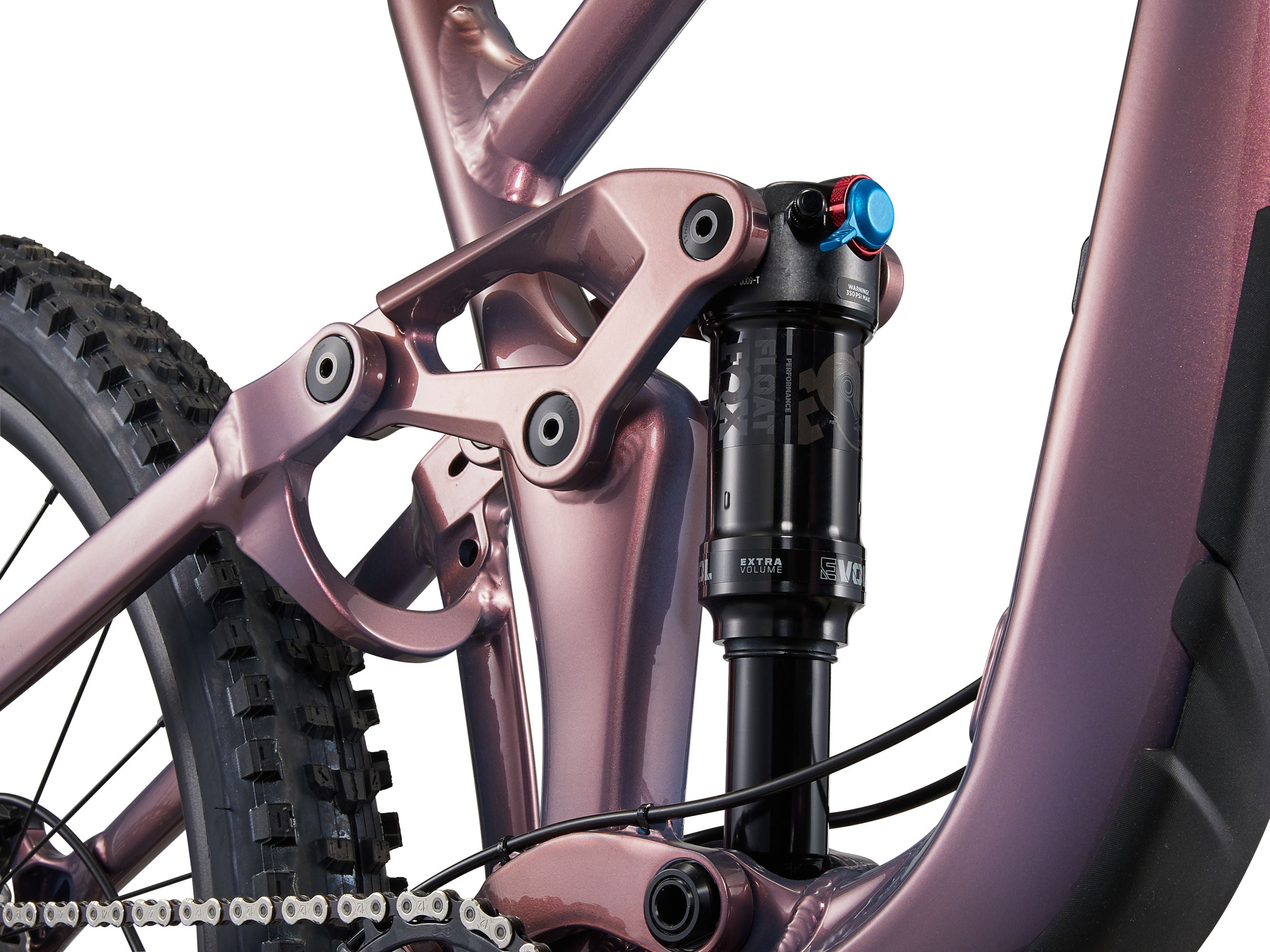 Close-up of a pink bicycle frame with suspension fork on a white background