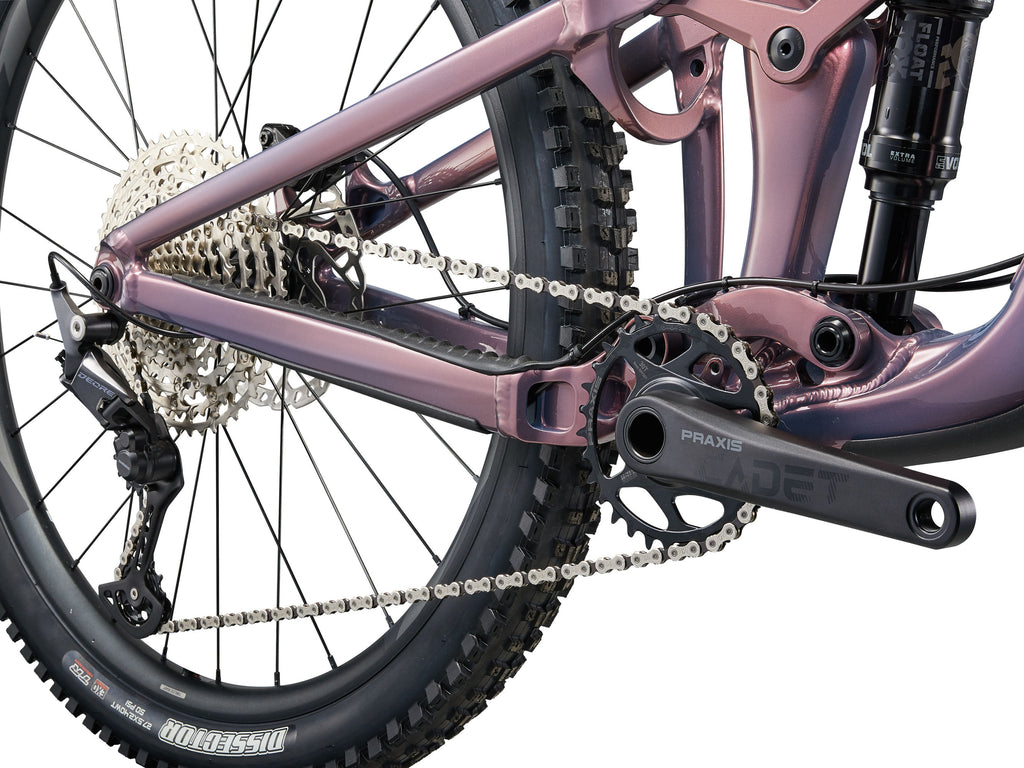Close-up of a bicycle's chain and gear system on a white background