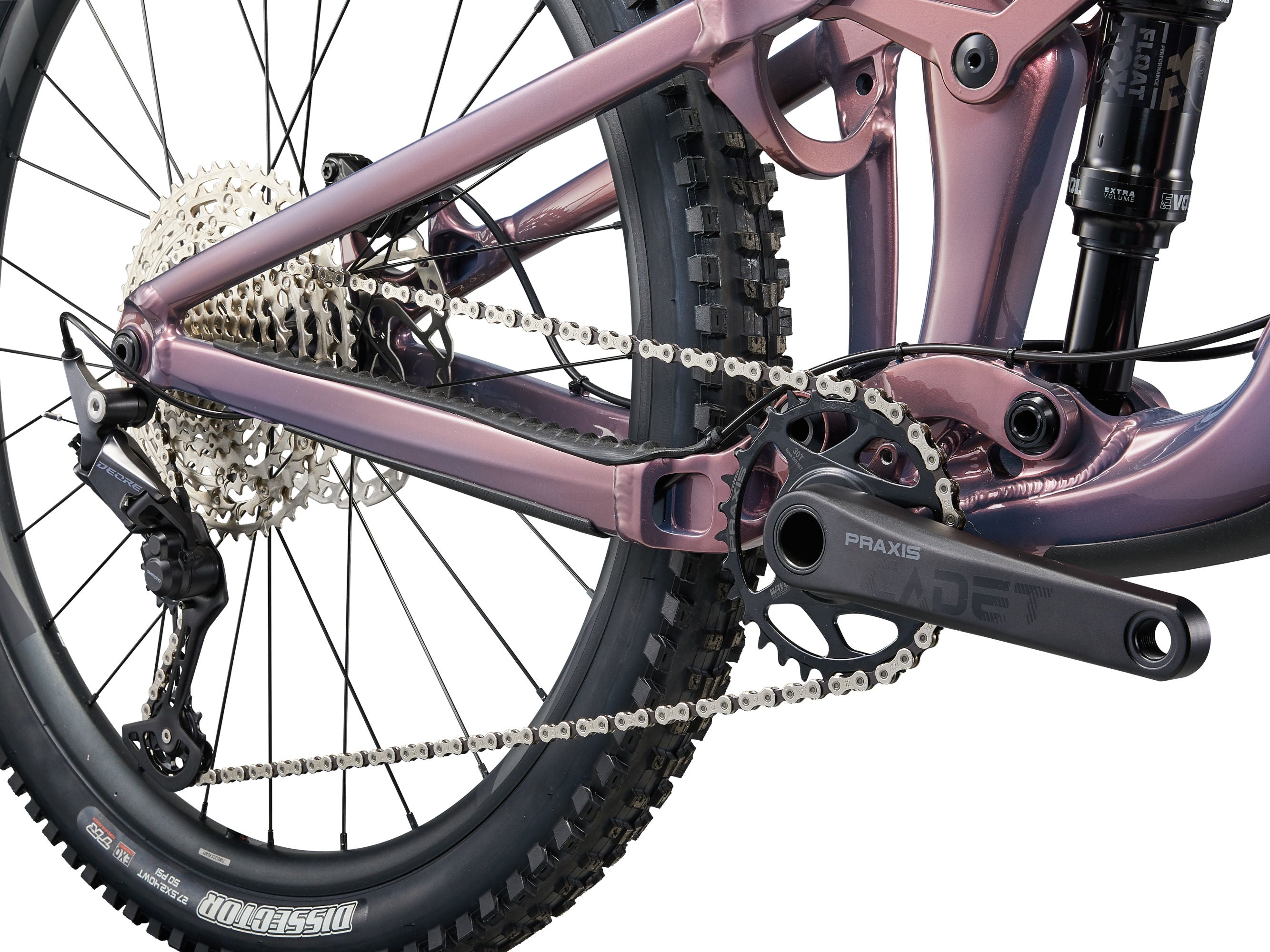 Close-up of a bicycle's chain and gear system on a white background