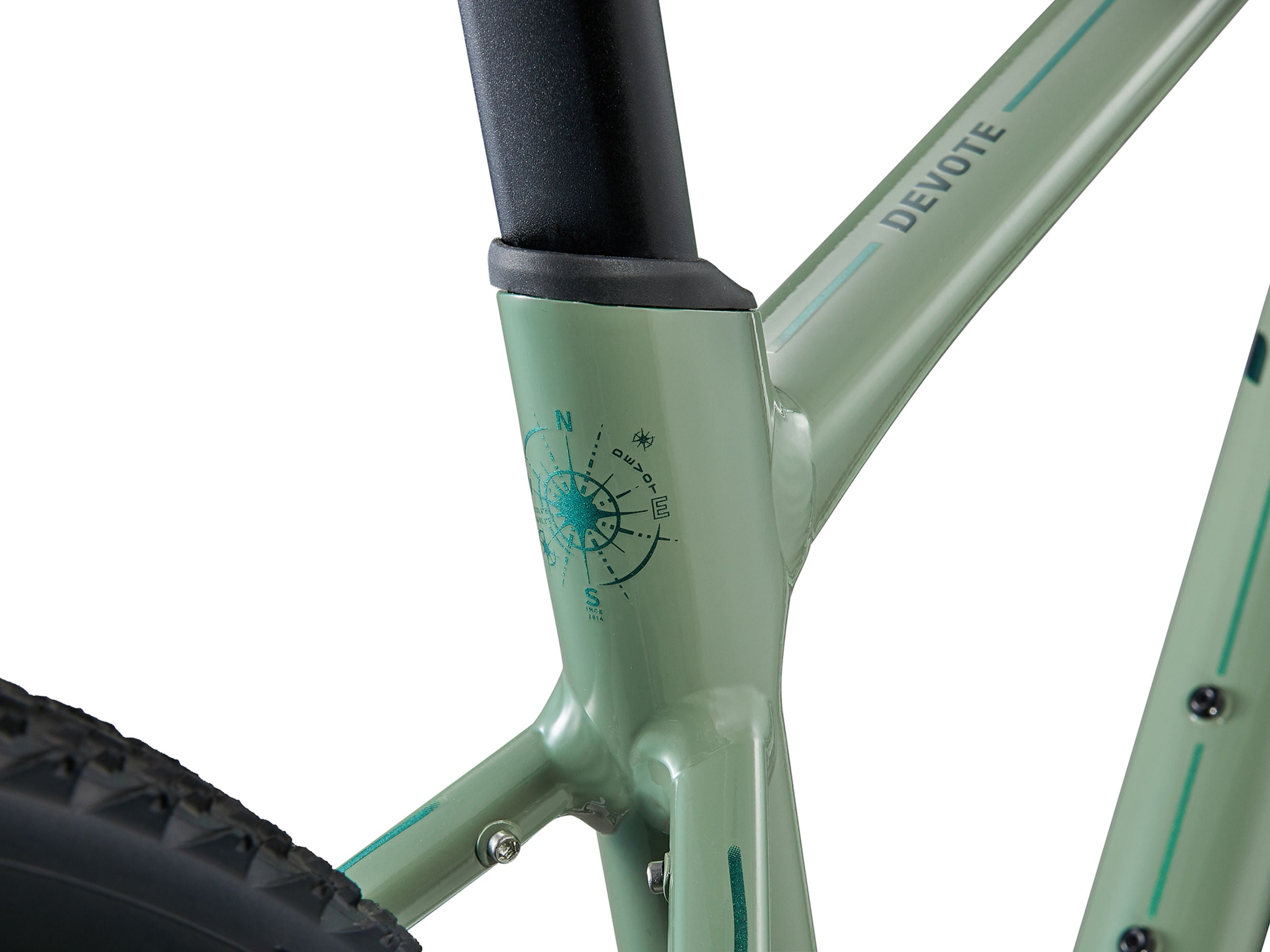 Close-up of a light green bicycle frame with 'Devote' branding on a white background
