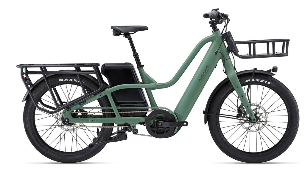 Green cargo bike with a black seat and basket on a white background