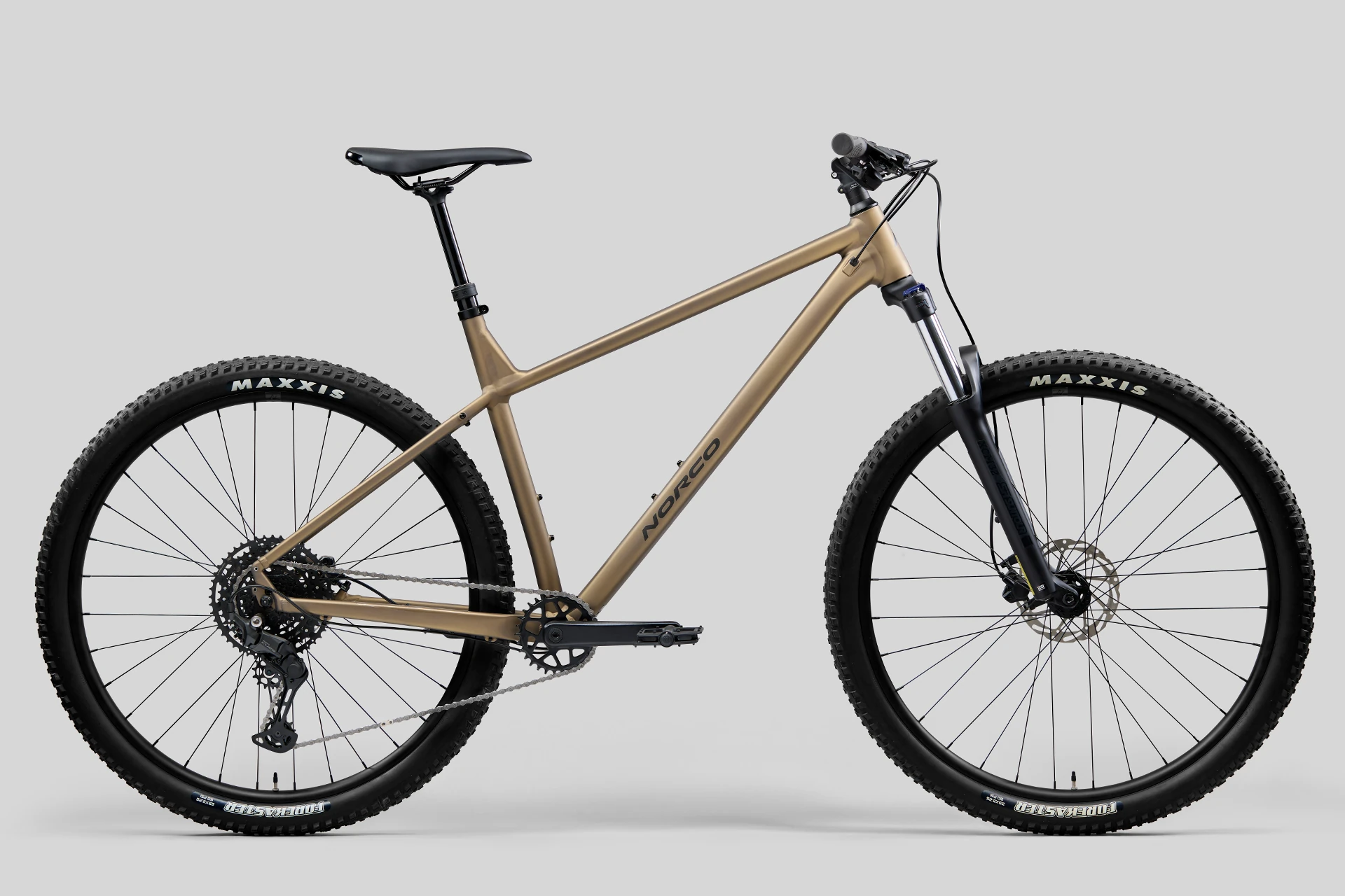 Beige mountain bike on a gray background