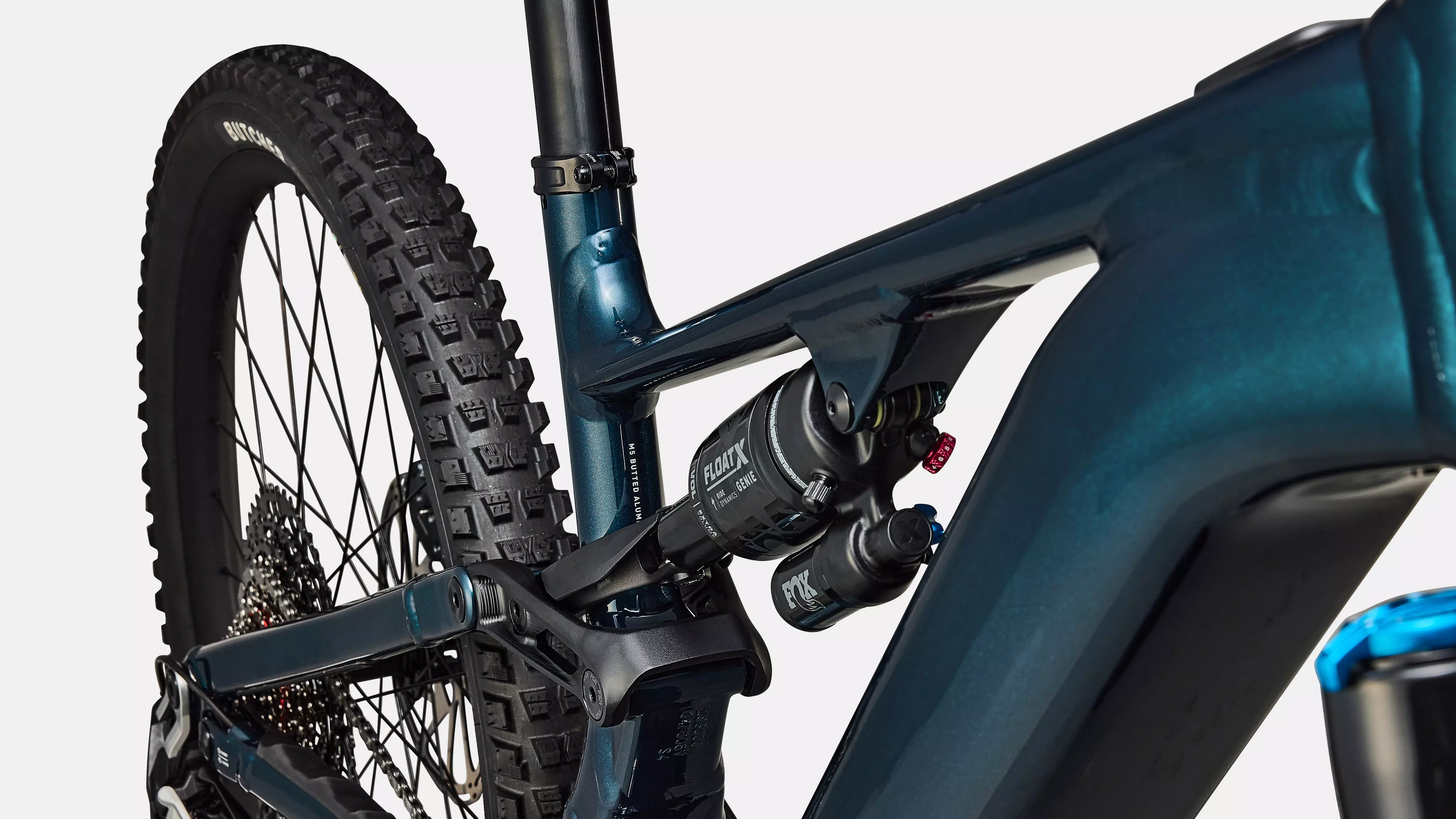Close-up of a mountain bike with focus on the suspension fork and tire.