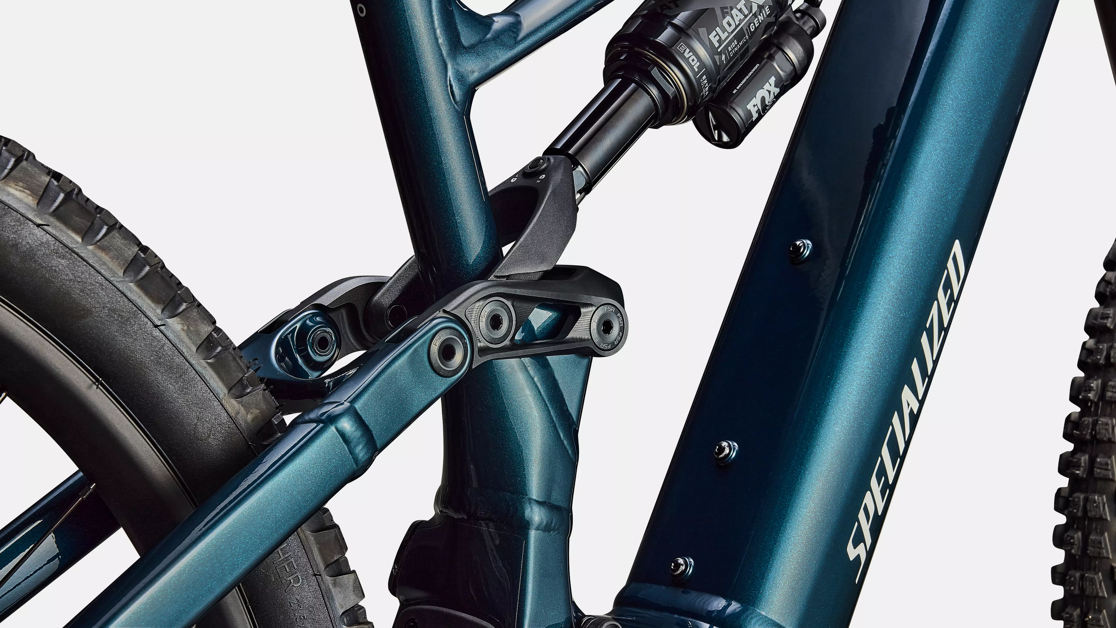 Close-up of a teal bicycle frame with 'Specialized' branding on a white background
