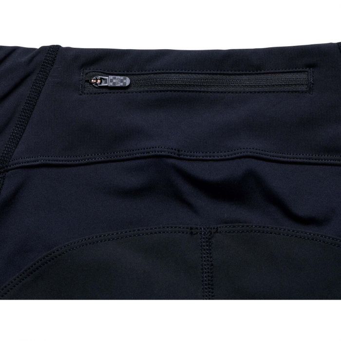 Close-up of a black athletic shorts with a zipper pocket on a white background