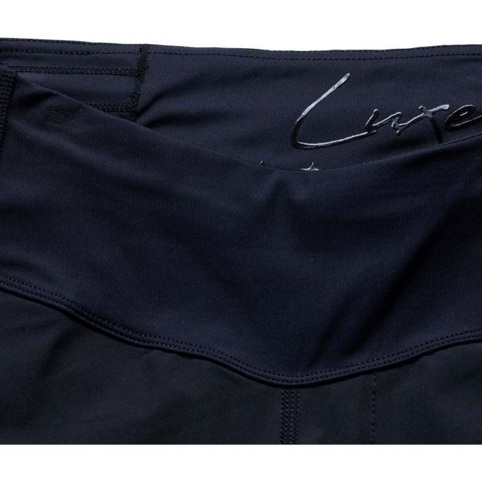 Navy blue fabric with a signature logo on a white background