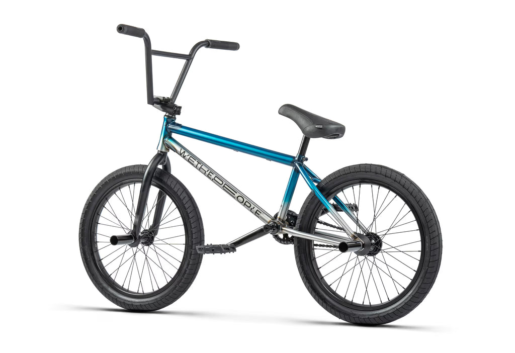 BMX bike with blue frame and black wheels on a white background