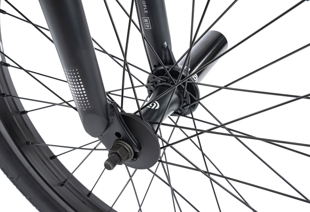 Close-up of a bicycle wheel with a white background