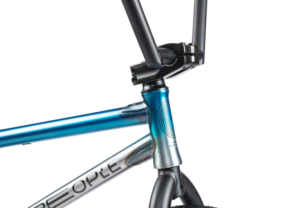 Close-up of a bicycle frame with blue and silver color scheme on a white background