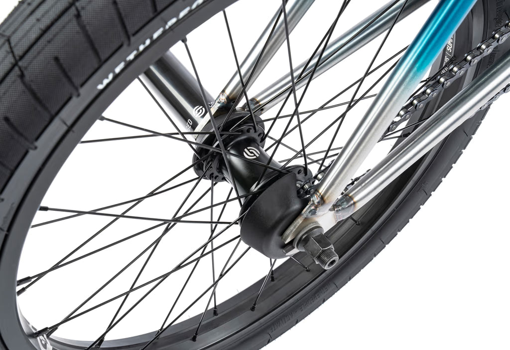 Close-up of a bicycle wheel with a white background