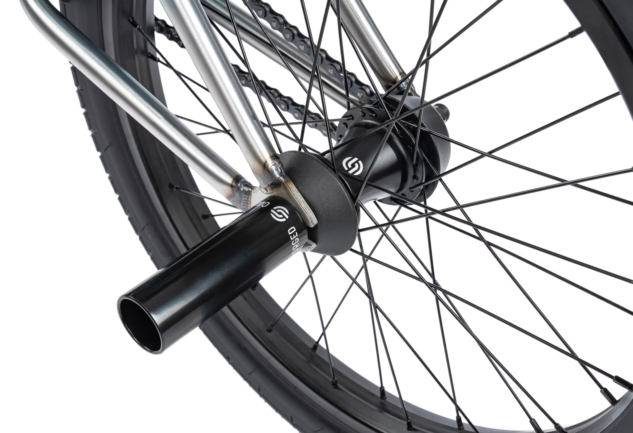 Close-up of a bicycle wheel with a black hub and silver spokes on a white background