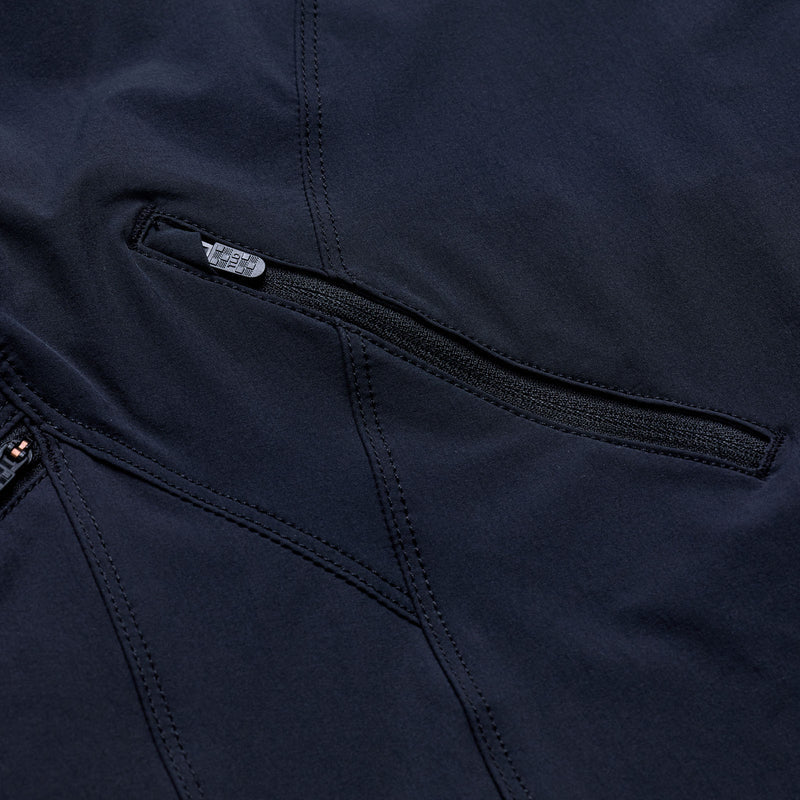 Close-up of a navy blue jacket with a zipper and brand logo.